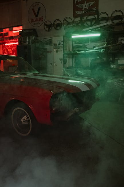Classic car in a garage with atmospheric neon lighting and smoke.